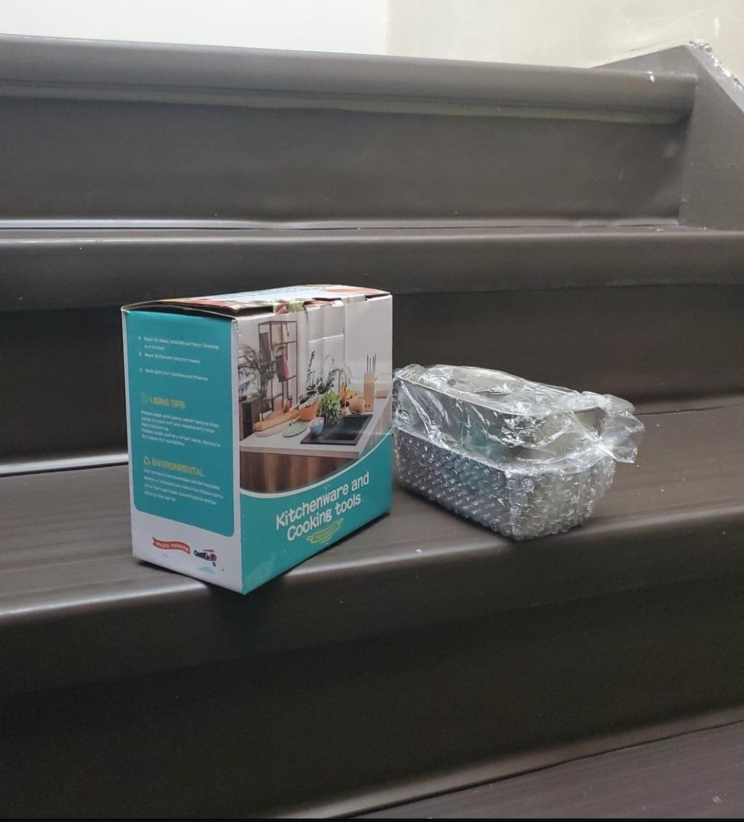Raw Android product photo of kitchenware and cooking tools on stairs before Portrait Drop